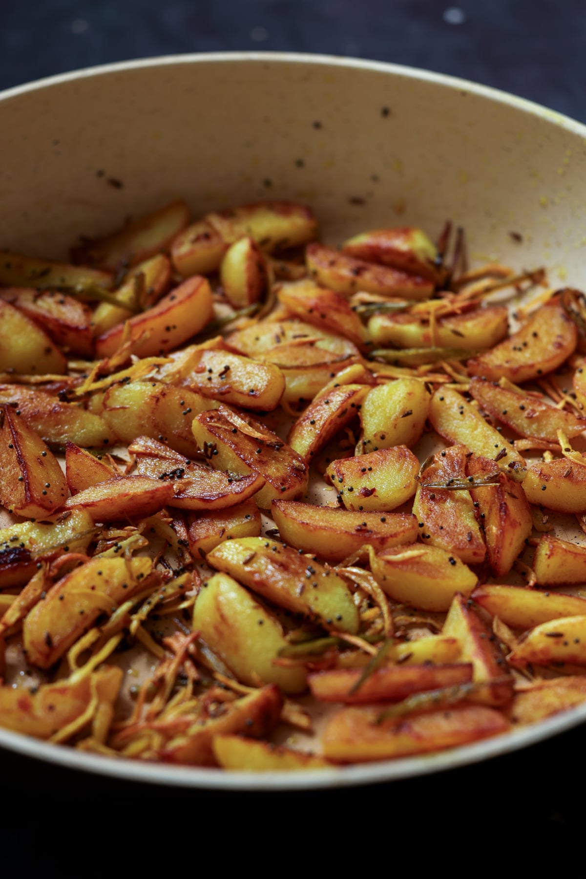 side view of Nepali aloo in the pan after cooking