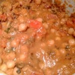 A close up of Kadhai Chole being cooked in a white pan