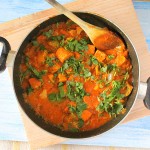 Kadai Gobi in a pan with a wooden spoon in it.