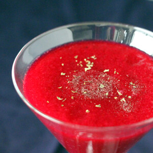 Red Beet, Pear, Minneola orange and Apple Smoothie served in a martini glass