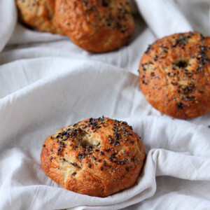 Wheat bagels placed on white fabric