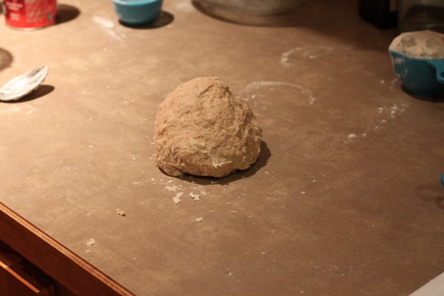 vegan cinnamon rolls cinnamon rolls dough shaped into a ball on a kitchen counter ready to be rolled out