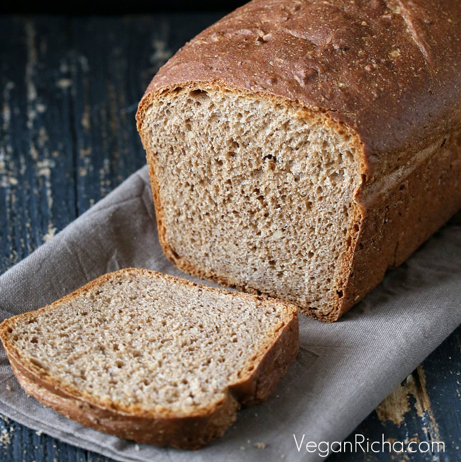 vegan burger buns Vegan Rye Almond Sandwich Bread with one slice cut
