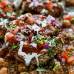 extreme close-up of the potato patty with toppings