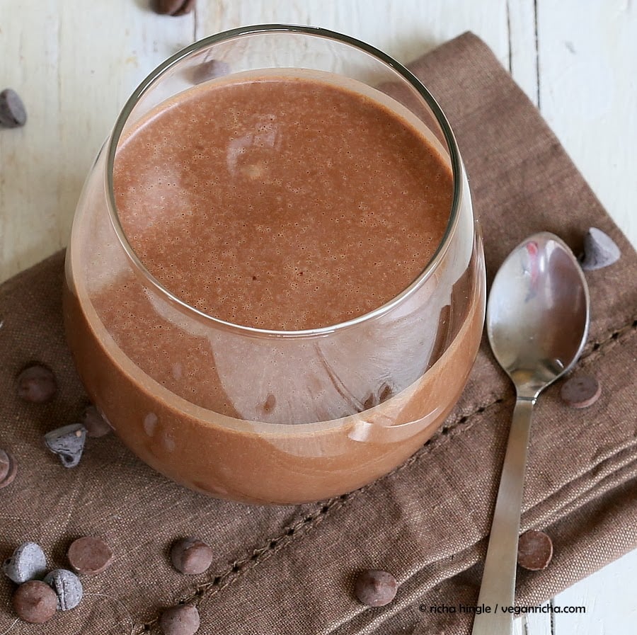 vegan milkshake overhead shot of a glass with healthy creamy and thick vegan chocolate milkshake