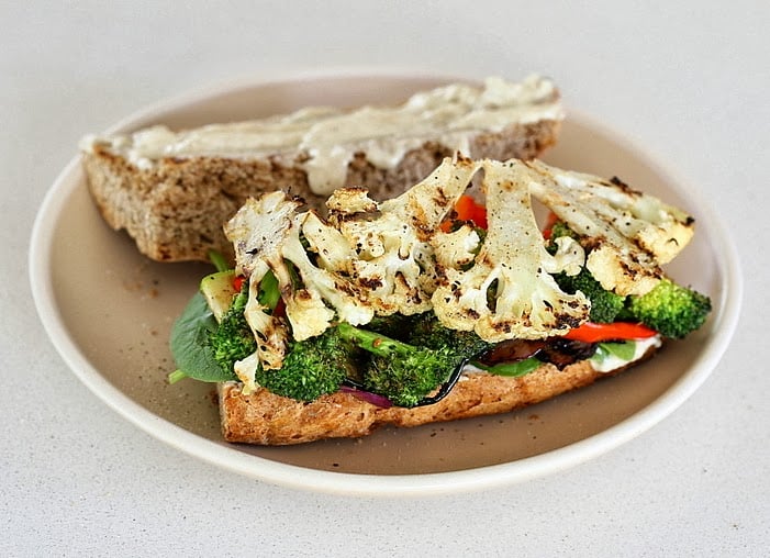 vegetable sandwich healthy almond flour sandwich bun topped with roasted cauliflower and broccoli florets