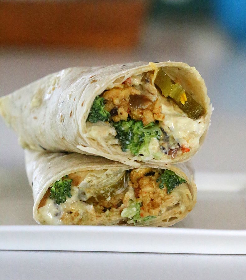 vegan wrap recipe two stacked Tofu Wraps filled with Tempeh Scramble, Jalapeno Popper Dip and Broccoli