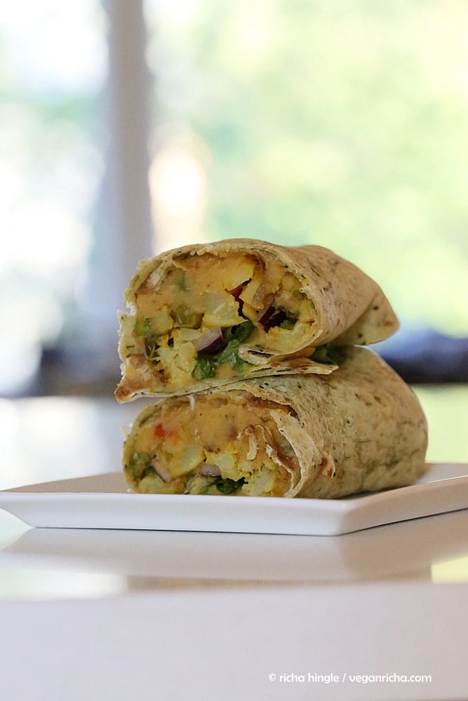 vegan hummus wrap a cut and stacked vegan red lentil hummus wrap with cauliflower and broccoli