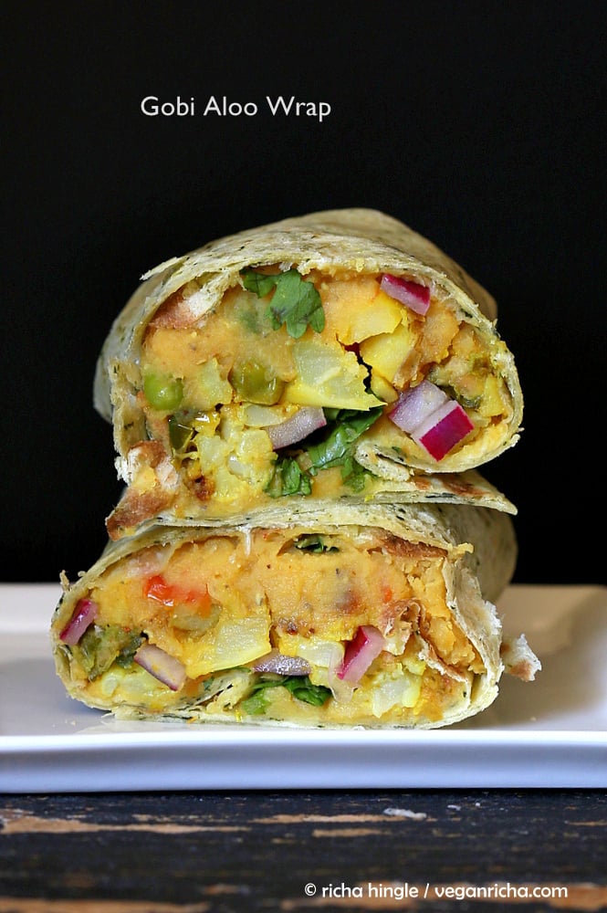 vegan hummus wrap stacked vegan red lentil hummus wraps with pickled onions, potatoes and cauliflower