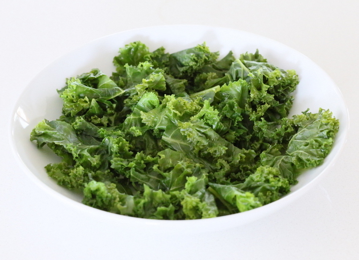 kale salad recipe massaged kale in a small white bowl