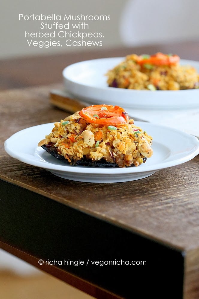 stuffed portobello mushrooms side view of Vegan Stuffed Portobello Mushrooms filled with Herbed Chickpeas, veggies, and cashews