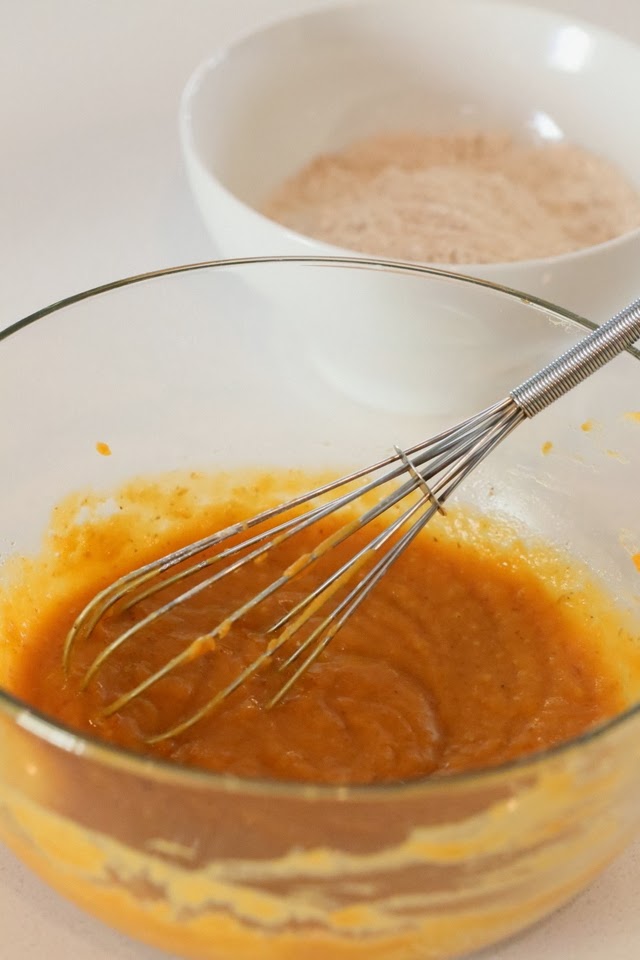 recipe for vegan donuts wet ingredients for vegan sweet potato donuts being whisked in a glass bowl