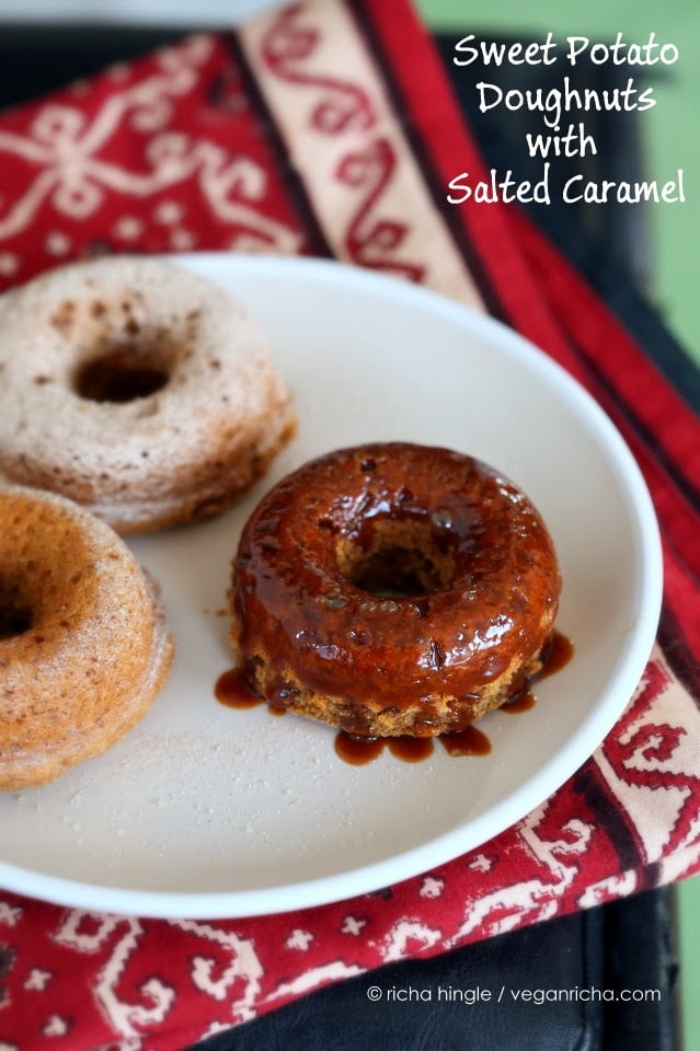 recipe for vegan donuts three vegan baked sweet potato donuts on a white plate