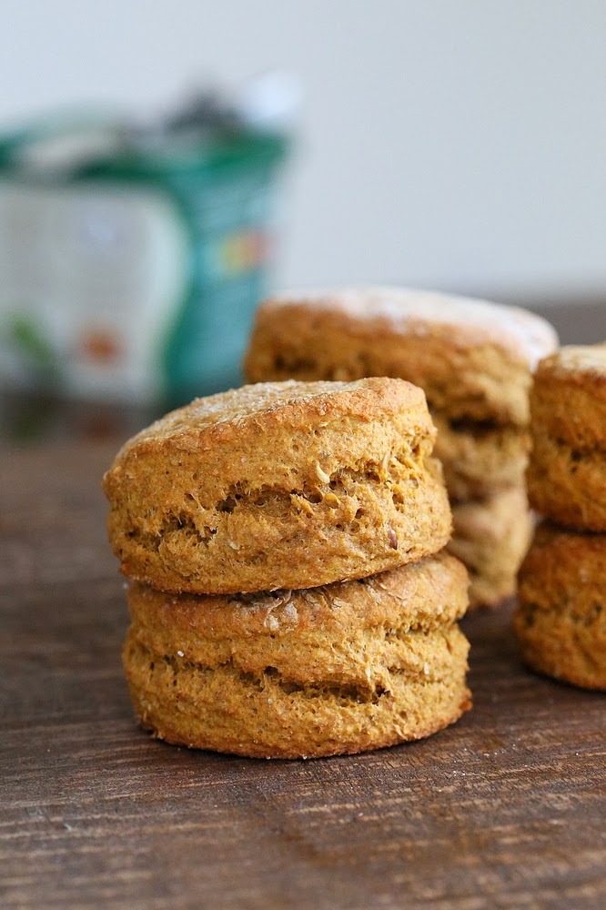 sweet potato biscuits side view of stacked healthy vegan sweet potato biscuits on a wooden board