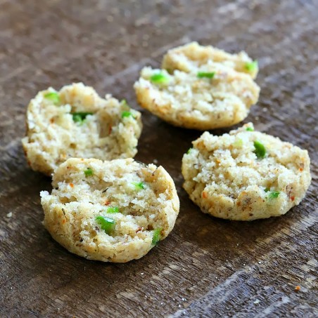recipe for gluten free biscuits two small gluten-free cheese biscuits cut into halves to reveal specks of jalapeno pepper
