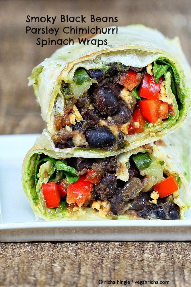 two stacked halves of a Vegan Smoky Black Bean Wrap with Parsley Chimichurri and Spinach 