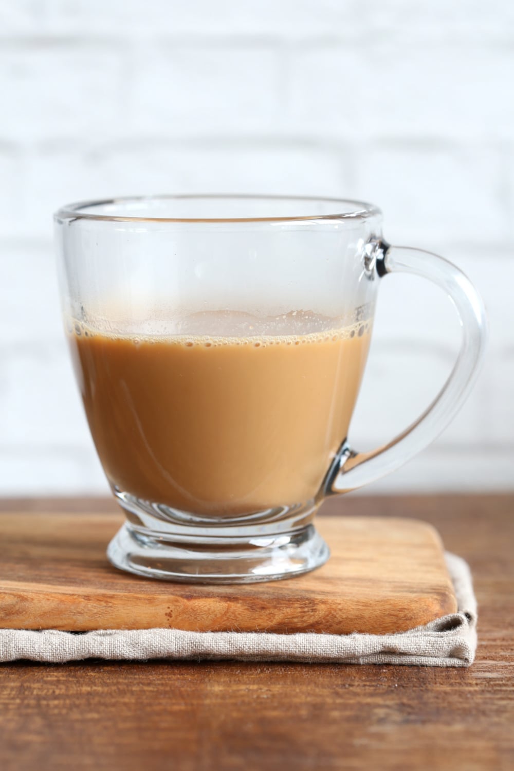 Vegan Indian Masala Chai. Fabulous almond milk tea with fresh ginger and homemade chai spice blend with cardamom, cinnamon, pepper. Flavorful traditional Indian Chai made #vegan #veganricha #veganchai