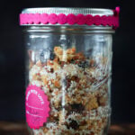 red lentil granola in a decorated mason jar for gifting