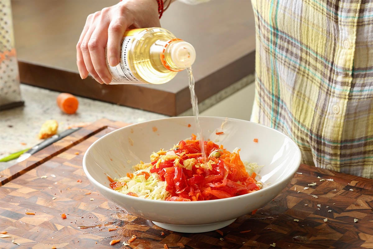 adding rice vinegar to the veggies
