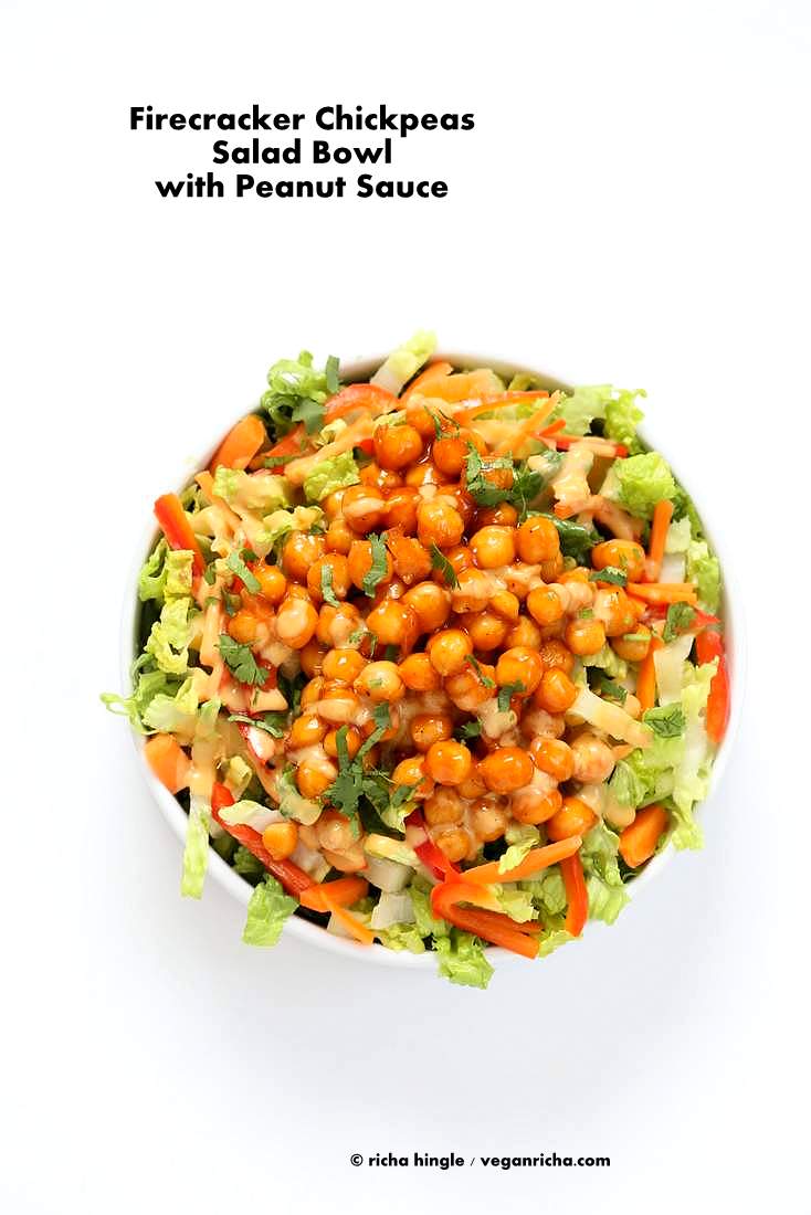 Chickpeas tossed in sweet spicy firecracker sauce and cooked to thicken the sauce. Firecracker Chickpeas Served with a crunchy lettuce, carrot, red bell pepper salad, a light drizzle of peanut sauce and garnished with cilantro/scallions #vegan #veganricha #glutenfree | Vegan Richa