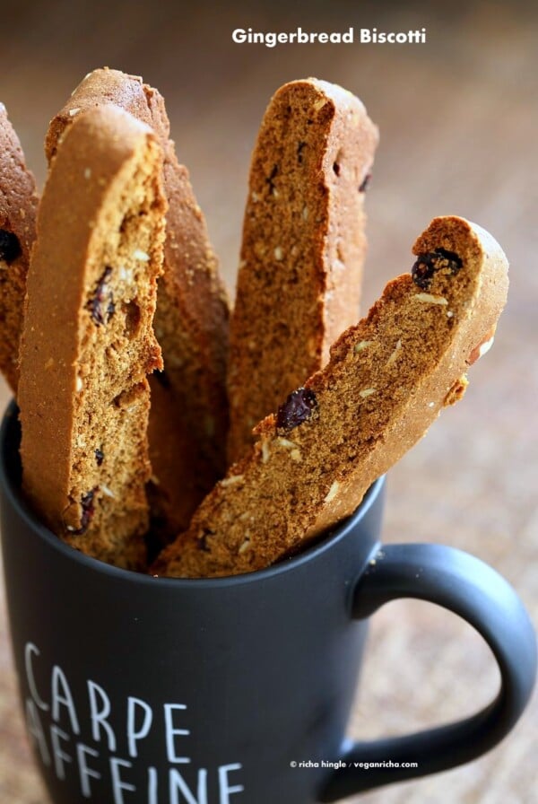 Vegan Gingerbread Biscotti with cranberries, almonds, candied ginger. Easy Crispy Spiced Biscotti Recipe to dunk in a cup of tea. Drizzle with white or dark chocolate. | VeganRicha.com #vegan #gingerbread #biscotti #recipe #veganricha