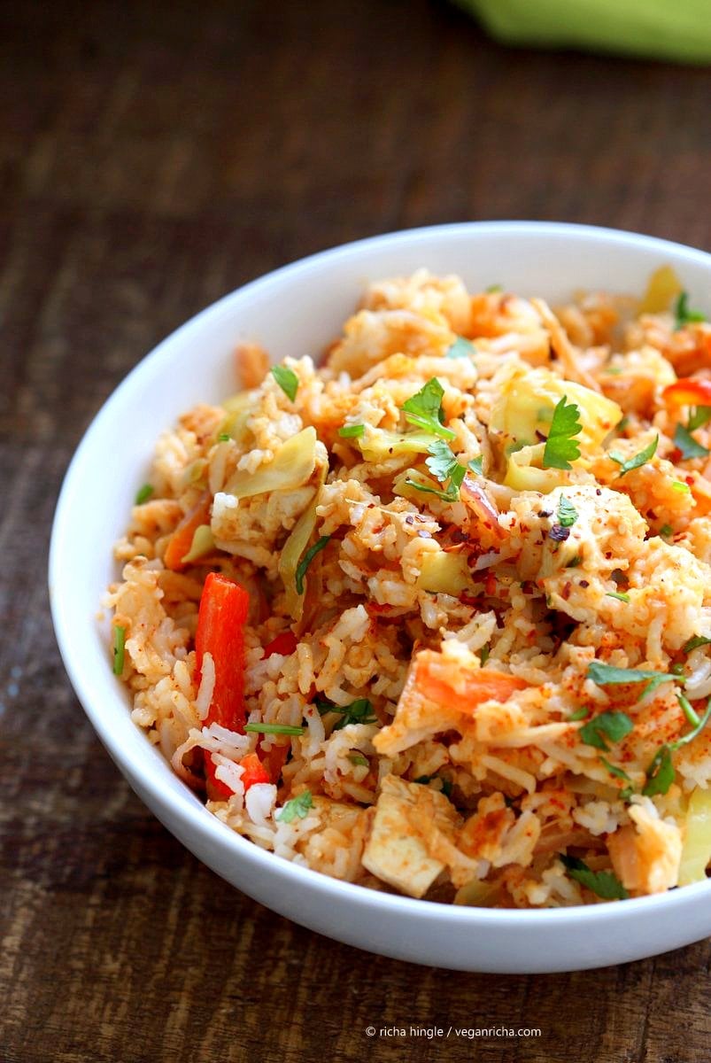 Peanut Sauce Fried Rice with Tofu, Carrots, red bell pepper, Cabbage and cilantro. Use cooked chickpeas to make soy-free, | VeganRicha.com #vegan #glutenfree #friedrice 