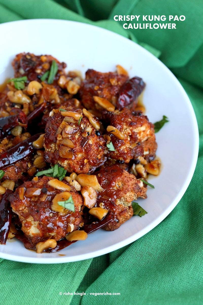 Crispy Kung Pao Cauliflower. Cauliflower battered and baked and tossed in spicy kung pao sauce. | VeganRicha.com #vegan #appetizer #snack #cauliflower #kungpao #recipe