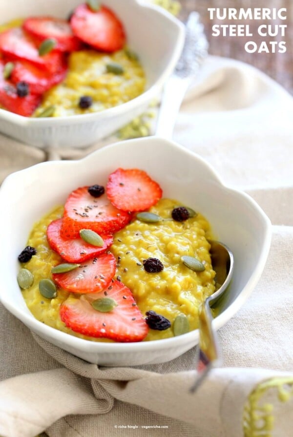 Turmeric Steel Cuts Oats with turmeric, cinnamon and cardamom. Serve with Strawberries, chia seeds and other garnishes of choice. Easy Make ahead Breakfast Recipe Vegan Glutenfree Soyfree.| VeganRicha.com #glutenfree #veganricha #vegan