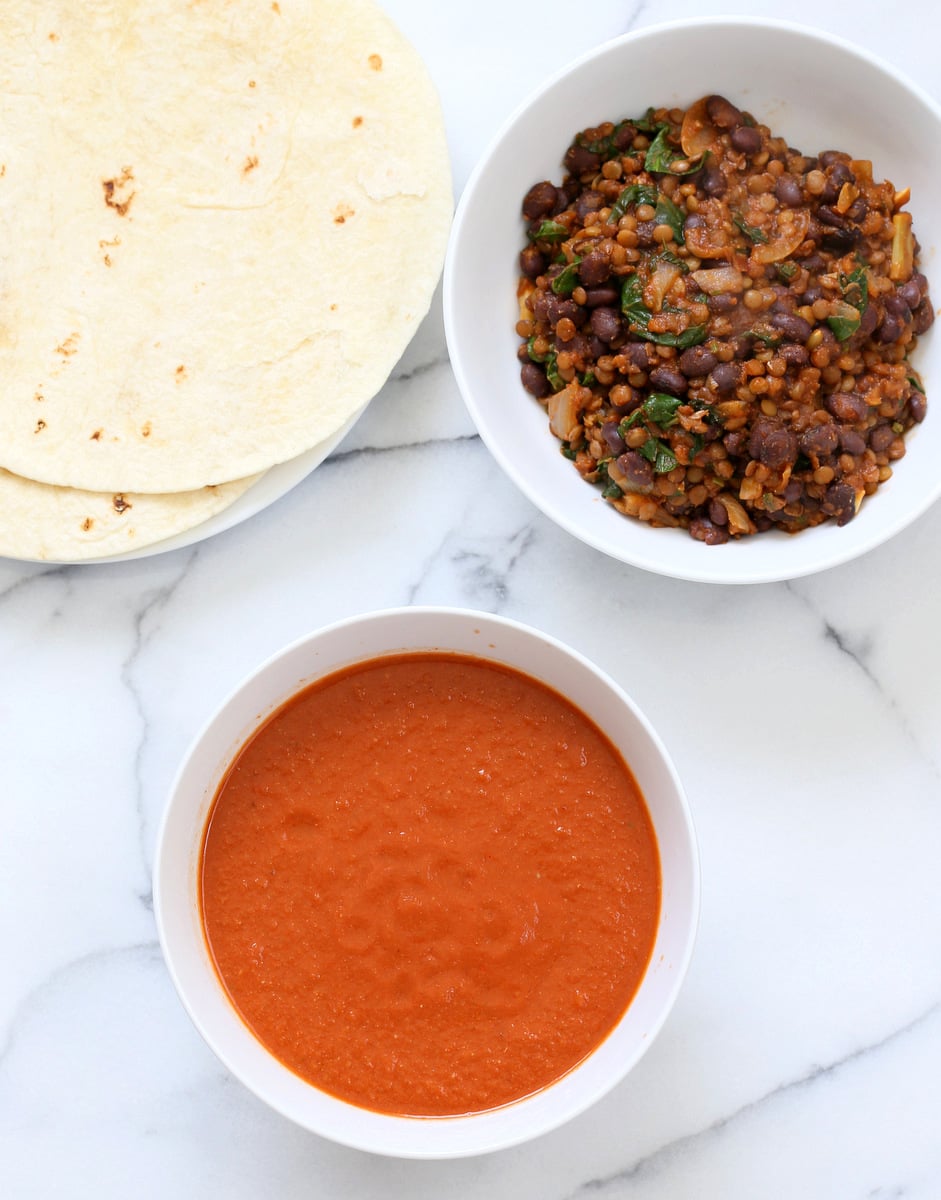 Vegan Enchiladas Recipe. Easy Enchilada Recipe with Blender Enchilada Sauce, soft tortillas filled with Black beans and Lentils. Vegan Soy-free Recipe. Can be Gluten-free. Ready within 1 Hour. | VeganRicha.com