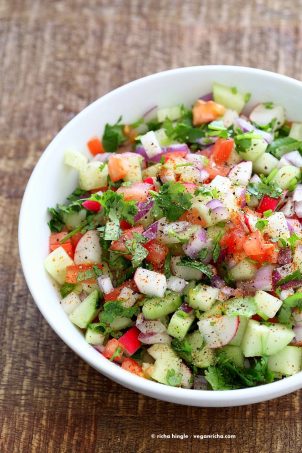 Kachumber Salad - Cucumber Tomato Onion Salad Recipe. Kachumbar is a simple chopped Summer Salad with chopped onions, tomatoes, cucumbers and a salt pepper lemon dressing. Serve as a side with Indian curries, or as a dip with chips, or over burgers. Vegan Gluten-free Soy-free Oil-free Recipe | VeganRicha.com