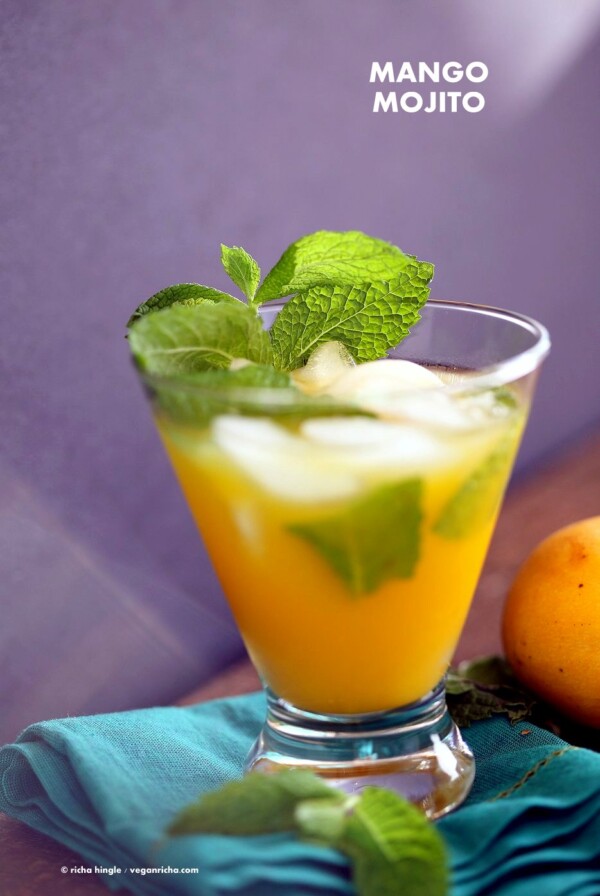 Easy Refreshing Mango Mojito Recipe. Make this mojito with or without the alcohol. Refreshing mint and lime and sweet Summery Mango make this a perfect drink for any outdoor event. Vegan Recipe | VeganRicha.com #vegan #glutenfree #veganricha