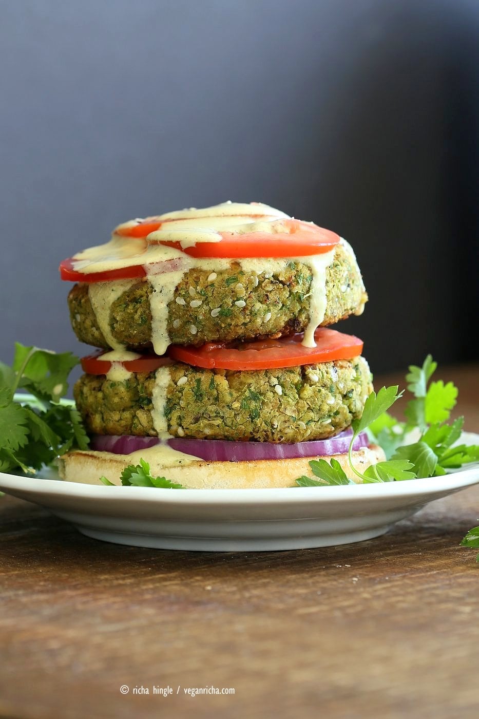 Easy Vegan Falafel Burger. Chickpea patties with tahini dressing and hummus make for a filling and flavorful burger. Vegan Soy-free Recipe. Can be made gluten-free | VeganRicha.com