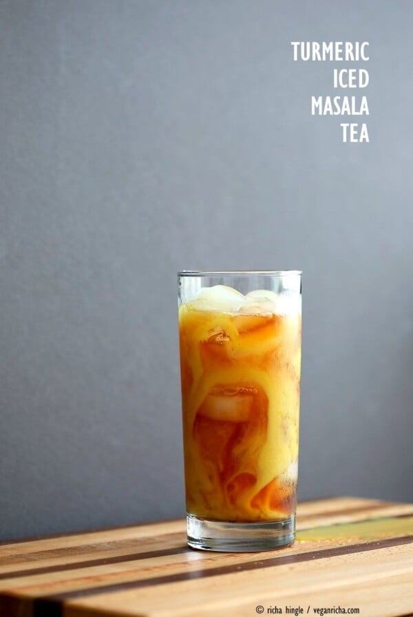 Cardamom Cinnamon Turmeric Iced Tea. Spiced Iced tea like Thai Iced tea with turmeric coconut milk and Indian masala chai spices and ginger. Golden Milk Iced Tea. Vegan Gluten-free Soy-free Recipe | VeganRicha.com #vegan #glutenfree #veganricha