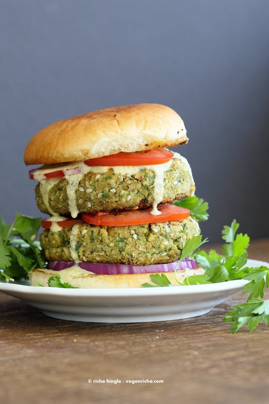 Easy Vegan Falafel Burger. Chickpea patties with tahini dressing and hummus make for a filling and flavorful burger. Vegan Soy-free Recipe. Can be made gluten-free | VeganRicha.com