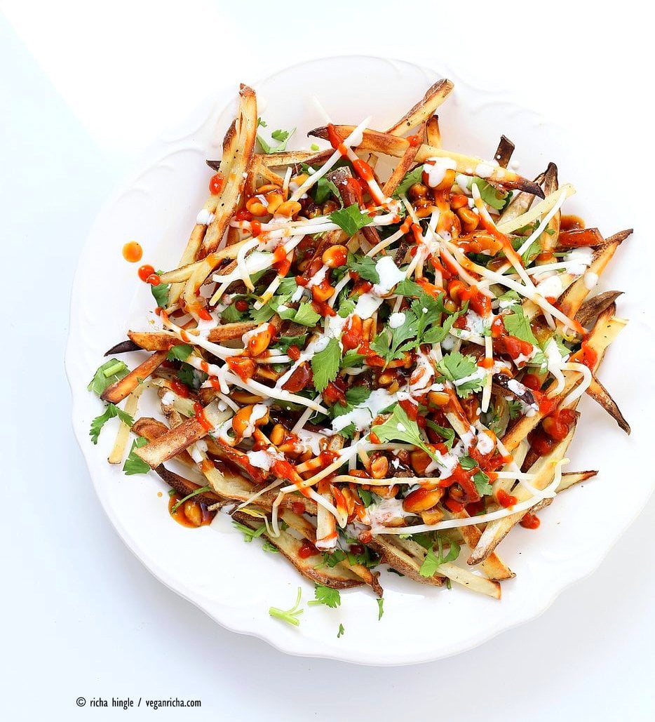Baked Vietnamese fries. Baked Potato strips, loads of cilantro and basil, bean sprouts, nuts in sweet chile sauce, sriracha and vegan mayo! Banh mi Sandwich in fries form. Vegan Gluten-free Recipe. | VeganRicha.com