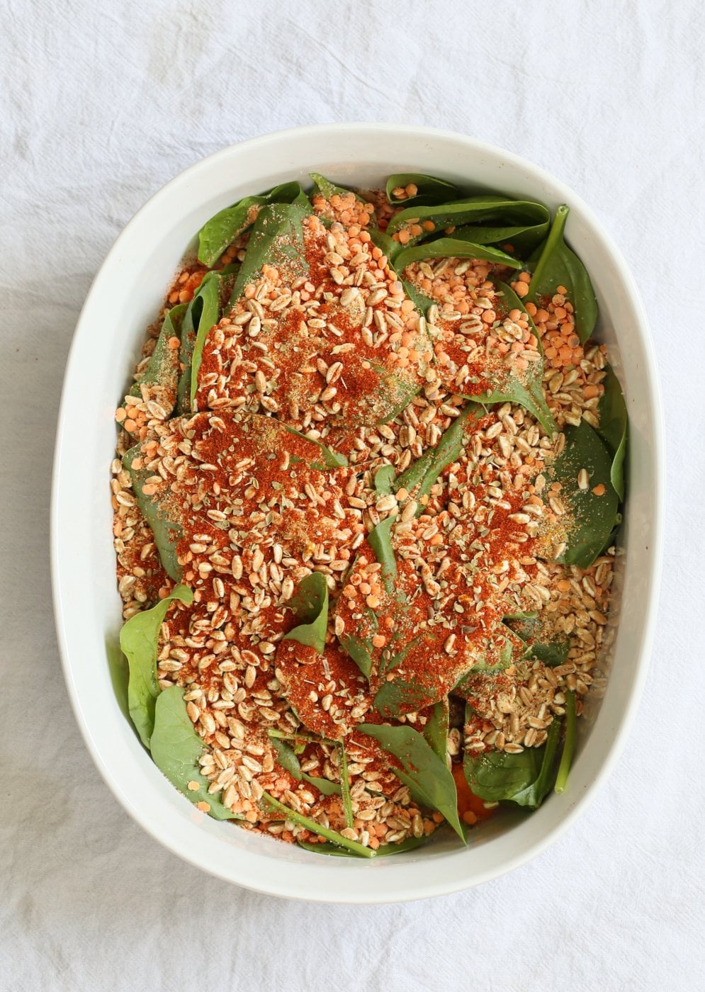 BBQ Lentil Farro Cauliflower Casserole. BBQ Casserole with Red Lentils, Farro, Veggies, Spinach, Cauliflower all layered and baked. Amazing Flavors! #Vegan #Glutenfree #Nutfree #Recipe. Can be soyfree #veganricha | VeganRicha.com