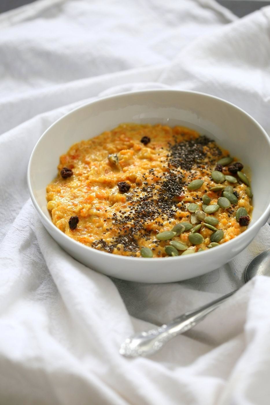 Carrot Pudding with Cardamom - Carrot Kheer Recipe. Shredded Carrots slow cooked with almond milk, roasted nuts and cardamom. Serve as is or top with toasted nuts, seeds and chia. Vegan Gluten-free Soy-free Nut-free option | VeganRicha.com