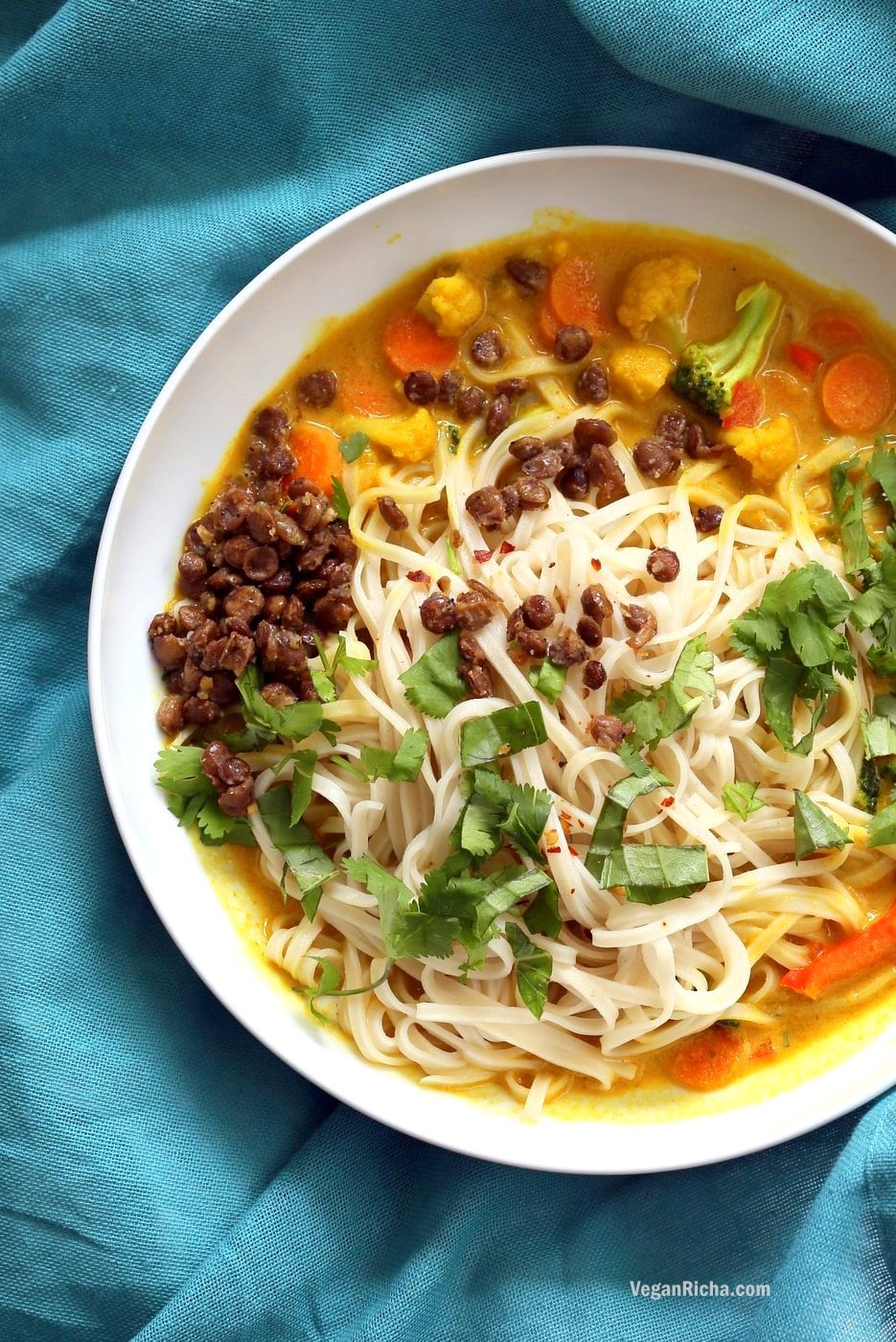 Curry Ramen with Miso Lentils Recipe. Spicy Curry flavored broth, vegetables, noodles, cilantro, basil and maple miso pepper lentils make this a must make vegan ramen. Vegan Gluten-free Soy-free Recipe | VeganRicha.com