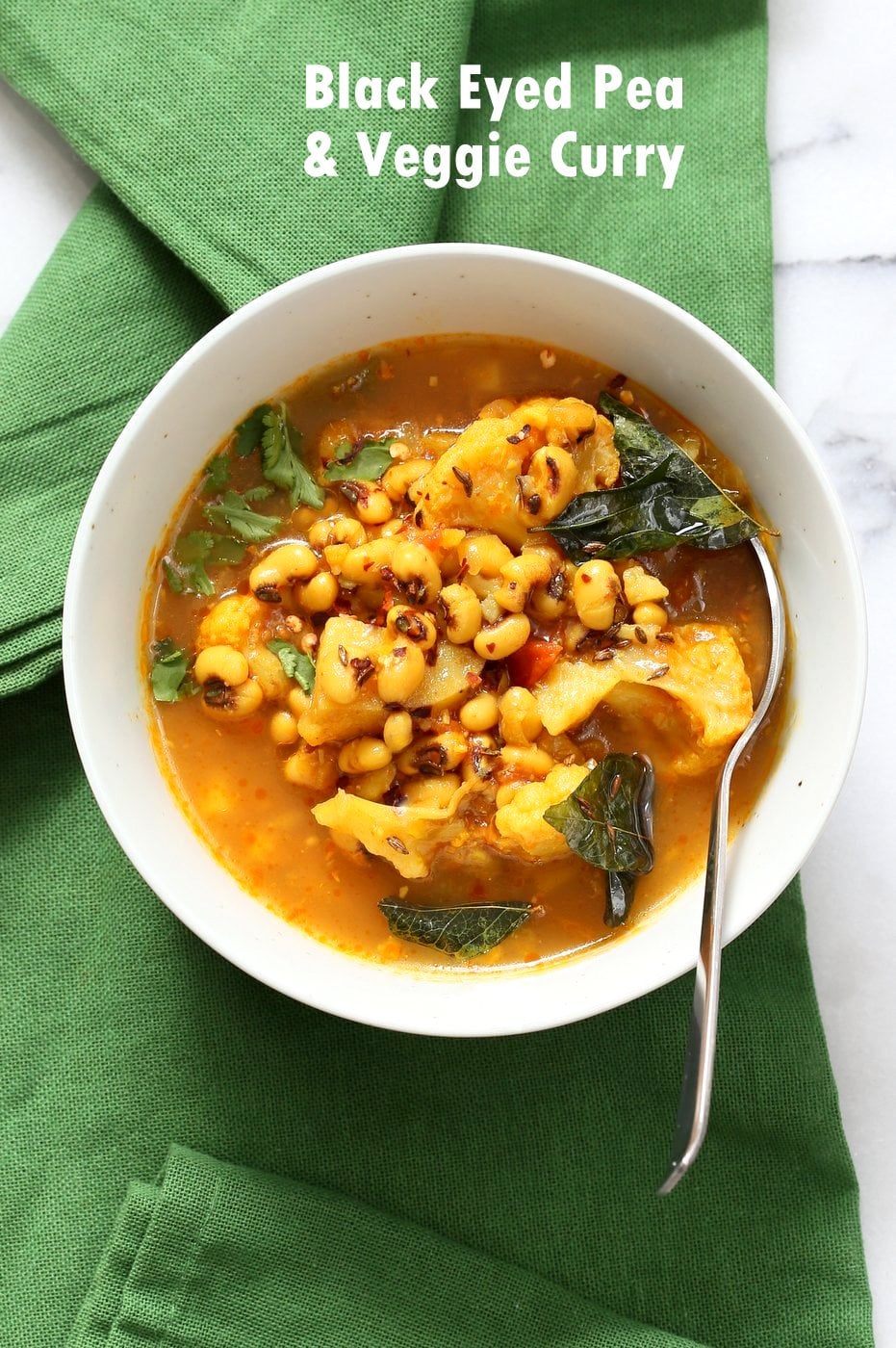 Black Eyed Pea Curry in a while Bowl with Green napkin