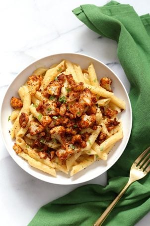 Vegan Garlic Pasta with Roasted Cajun Cauliflower. Cauliflower is tossed in homemade cajun spice blend and baked, then served over easy creamy Garlic sauce Penne Pasta. Vegan Recipe. Can be Nut-free gluten-free | VeganRicha.com