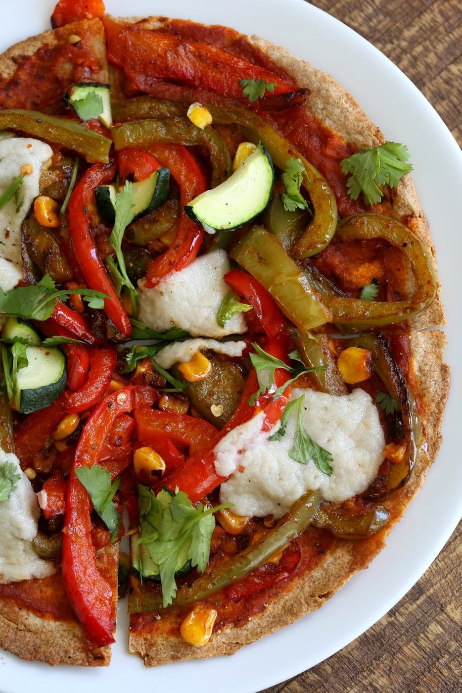 Easy Baked or Grilled Vegetable Fajitas Tortilla Pizza. Toss the peppers, corn and veggies in smoky Fajita Seasoning, then grill with vegan cheese. Top with salsa or other toppings. Vegan Soyfree Recipe. Easily Glutenfree | VeganRicha.com