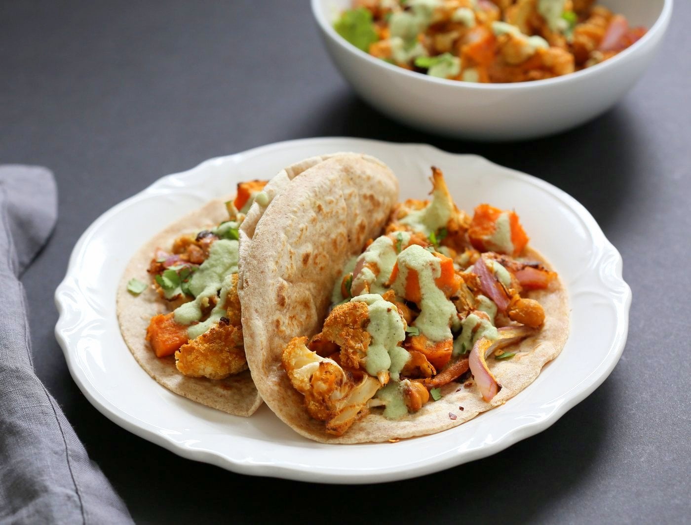 Cauliflower Sweet Potato Chickpea Tikka Wraps with Quick Coconut Chutney. Coconut Chutney makes everything amazing! Easy Weekday Meal. Vegan Soy-free Nut-free Recipe. Can be gluten-free with gluten-free wraps or tacos. | VeganRicha.com