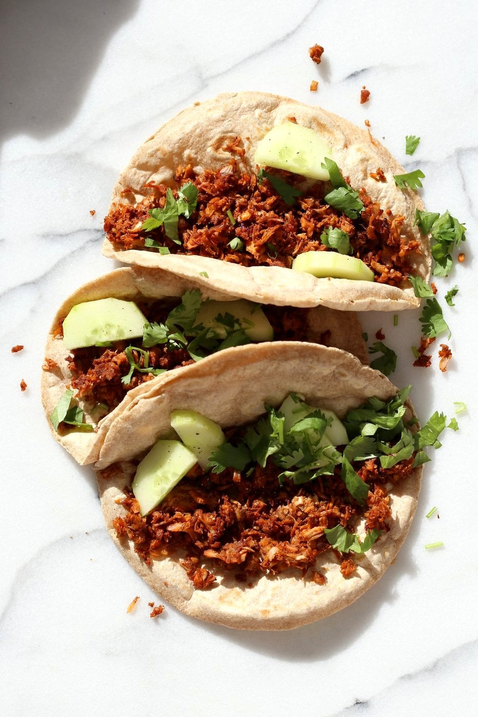 Berbere Spiced Jackfruit Tacos. Jackfruit and onion mixed with Berbere spice blend and baked to caramelized spiced perfection. Add some chickpeas to make into a hearty meal. Vegan Soy-free Nut-free Recipe, Can be Glutenfree | VeganRicha.com