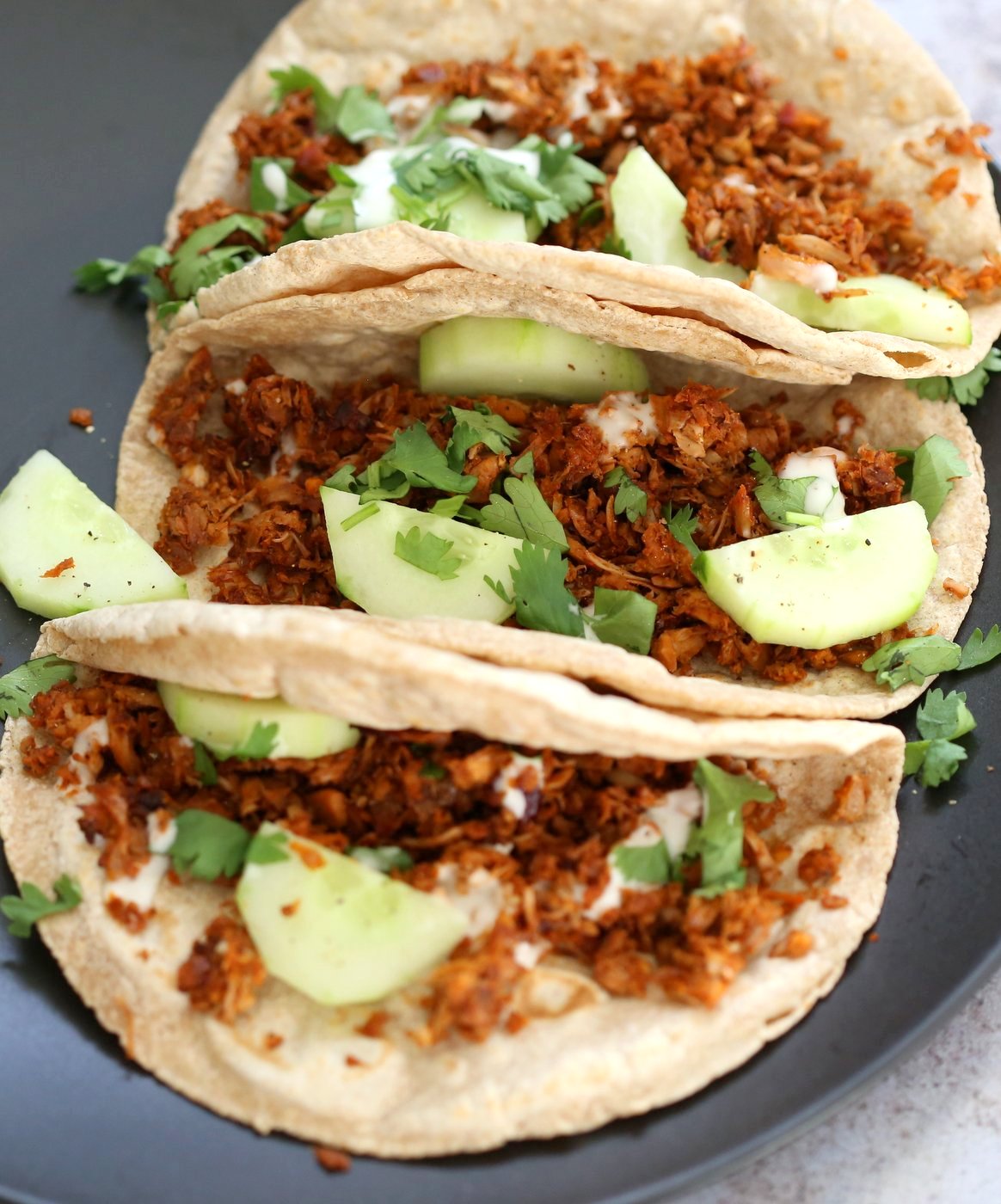 Berbere Spiced Jackfruit Tacos. Jackfruit and onion mixed with Berbere spice blend and baked to caramelized spiced perfection. Add some chickpeas to make into a hearty meal. Vegan Soy-free Nut-free Recipe, Can be Glutenfree | VeganRicha.com