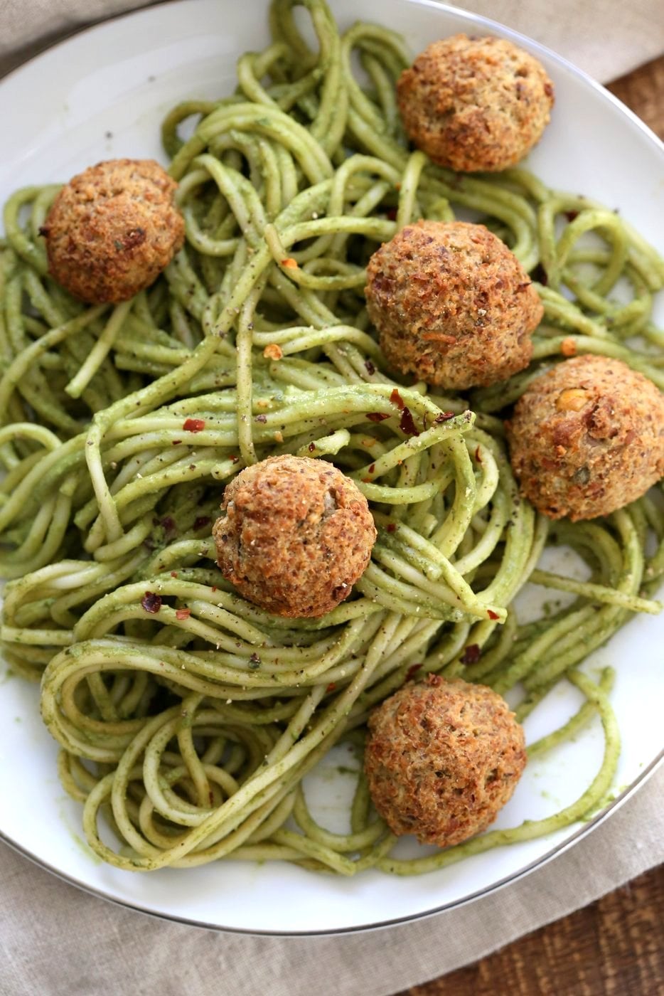 Amazing Pesto Spaghetti with Vegan Meatballs made with Chickpeas. Vegetarian Chickpea Walnut "meatballs" over pesto pasta. Ready in 40 Minutes. Vegan Soyfree Recipe. Can be Glutenfree | VeganRicha.com
