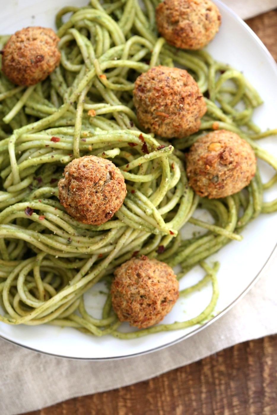 Amazing Pesto Spaghetti with Vegan Meatballs made with Chickpeas. Vegetarian Chickpea Walnut "meatballs" over pesto pasta. Ready in 40 Minutes. Vegan Soyfree Recipe. Can be Glutenfree | VeganRicha.com
