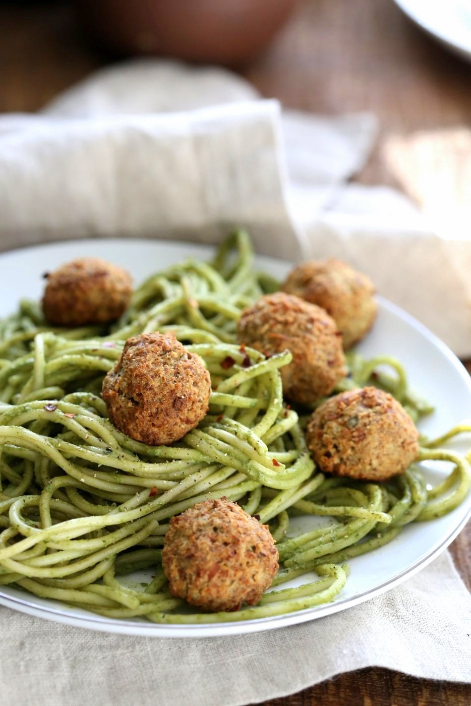 Amazing Pesto Spaghetti with Vegan Meatballs made with Chickpeas. Vegetarian Chickpea Walnut "meatballs" over pesto pasta. Ready in 40 Minutes. Vegan Soyfree Recipe. Can be Glutenfree | VeganRicha.com