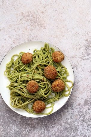 Amazingย Pesto Spaghetti with Vegan Meatballs made with Chickpeas. Vegetarian Chickpea Walnut "meatballs" over pesto pasta. Ready in 40 Minutes. Vegan Soyfree Recipe. Can be Glutenfree | VeganRicha.com