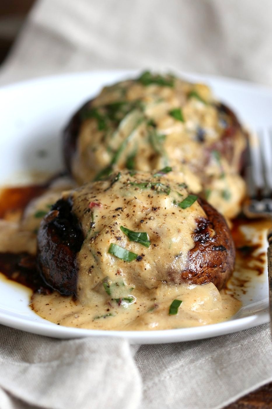 Grilled Portobello Mushrooms with Garlic Sauce. Grilled or Baked Marinated Portabella Mushrooms served with creamy gravy. #Vegan #Glutenfree #Recipe #veganricha | VeganRicha.com