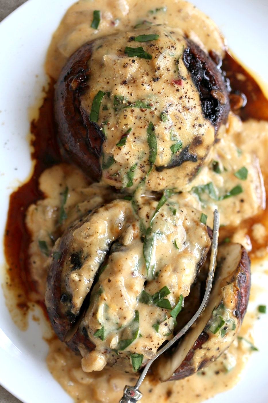 Grilled Portobello Mushrooms with Garlic Sauce. Grilled or Baked Marinated Portabella Mushrooms served with creamy gravy. #Vegan #Glutenfree #Recipe #veganricha | VeganRicha.com